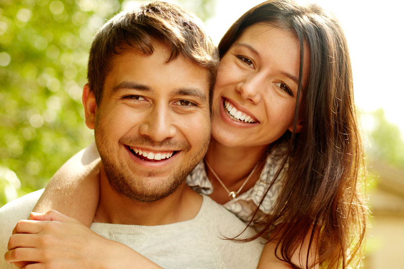 Dental Patients Smiling With Well Cared For Dental Implants In Bloomington, MN